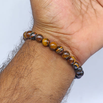Brown Tiger Eye bracelet by Tribal Ornaments featuring smooth beads, symbolizing strength and confidence.