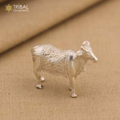 Vintage 925 sterling silver Kamdhenu cow pendant featuring Nakshi work, depicting a divine wishing cow with intricate tribal design.
