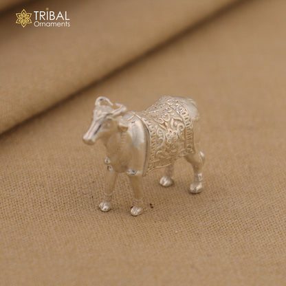 Vintage 925 sterling silver Kamdhenu cow pendant with intricate Nakshi work, depicting a divine wishing cow by Tribal Ornaments.
