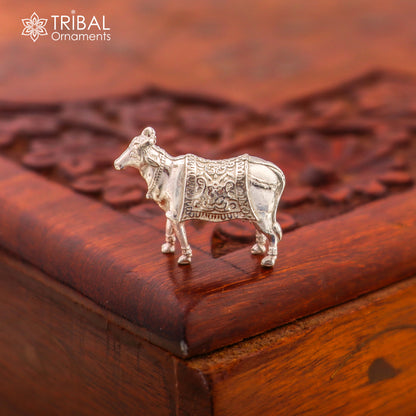 Vintage 925 sterling silver Kamdhenu cow pendant featuring intricate Nakshi work and divine deity design from Tribal Ornaments.