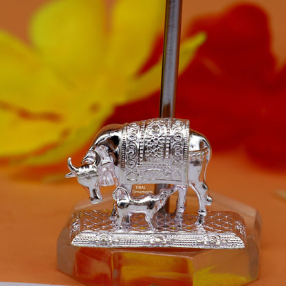 Silver Kamdhenu cow with calf figurine in 925 sterling silver, representing wealth and prosperity, decorative deity sculpture.