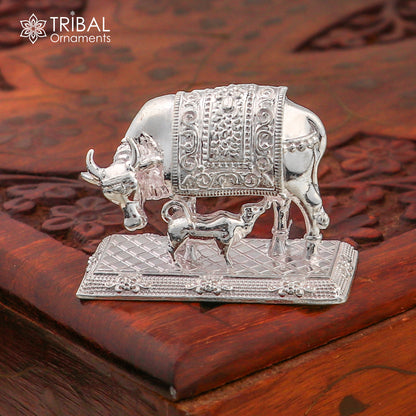 Vintage 925 sterling silver Kamdhenu cow with calf featuring Nakshi work, depicting a divine wishing cow art by Tribal Ornaments.
