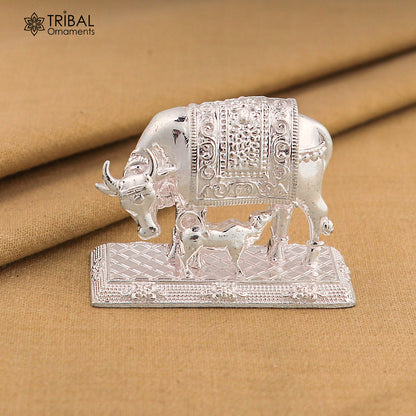 Sterling silver divine cow with calf jewelry featuring Nakshi work design, inspired by Kamdhenu, traditional tribal art.