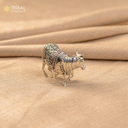 Silver divine cow with calf jewelry featuring vintage Nakshi work, Kamdhenu deity, and worshipping design in sterling silver.