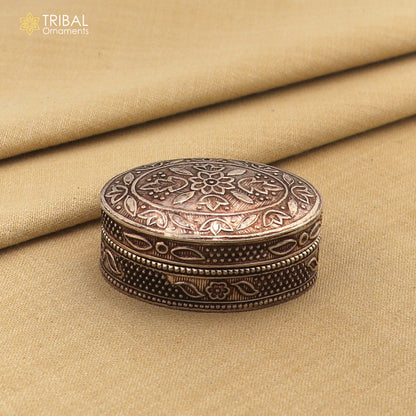 Small bridal kajal box made of 925 sterling silver, decorative jewelry and trinket container with vibrant vermilion accents.