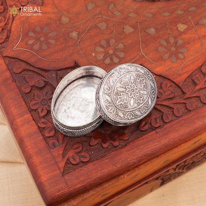 Small bridal kajal box in 925 sterling silver by TRIBAL ORNAMENTS, with intricate tribal design, perfect for jewelry or trinkets.