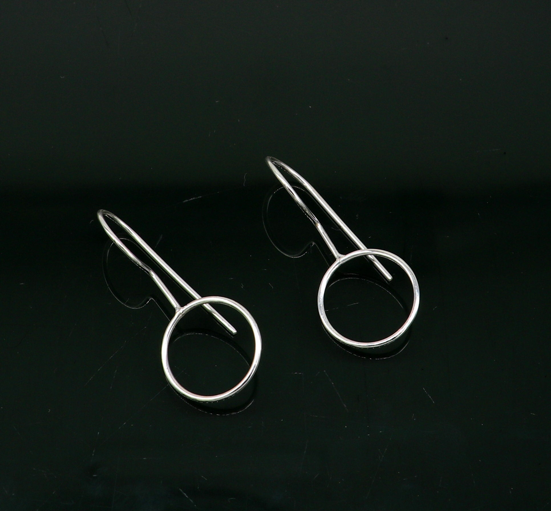 Sterling silver shiny circle hoops earrings from Tribal Ornaments, perfect for brides or gifting, featuring a elegant Indian design.