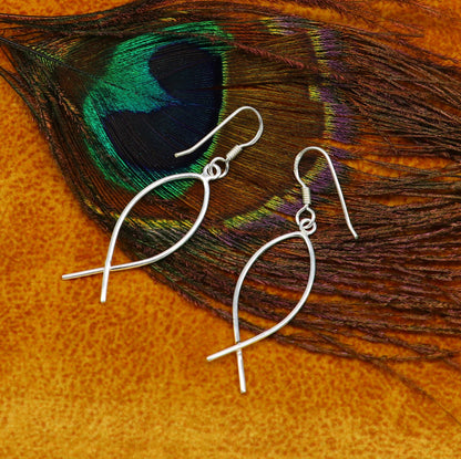 Fabulous fish-shaped sterling silver hoop earring by TRIBAL ORNAMENTS, lightweight designer jewelry perfect for brides or gifting.