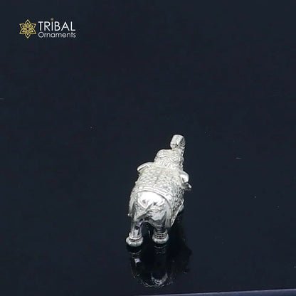 Solid 925 sterling silver elephant statue sculpture by TRIBAL ORNAMENTS, detailed figurine symbolizing wealth and prosperity.
