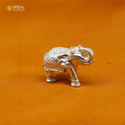 Solid 925 Sterling silver elephant figurine sculpture, detailed tribal design, symbolizing wealth and prosperity.