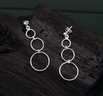 Sterling silver 925 dainty stud earring with three circle geometric design, drop dangle style, from TRIBAL ORNAMENTS.