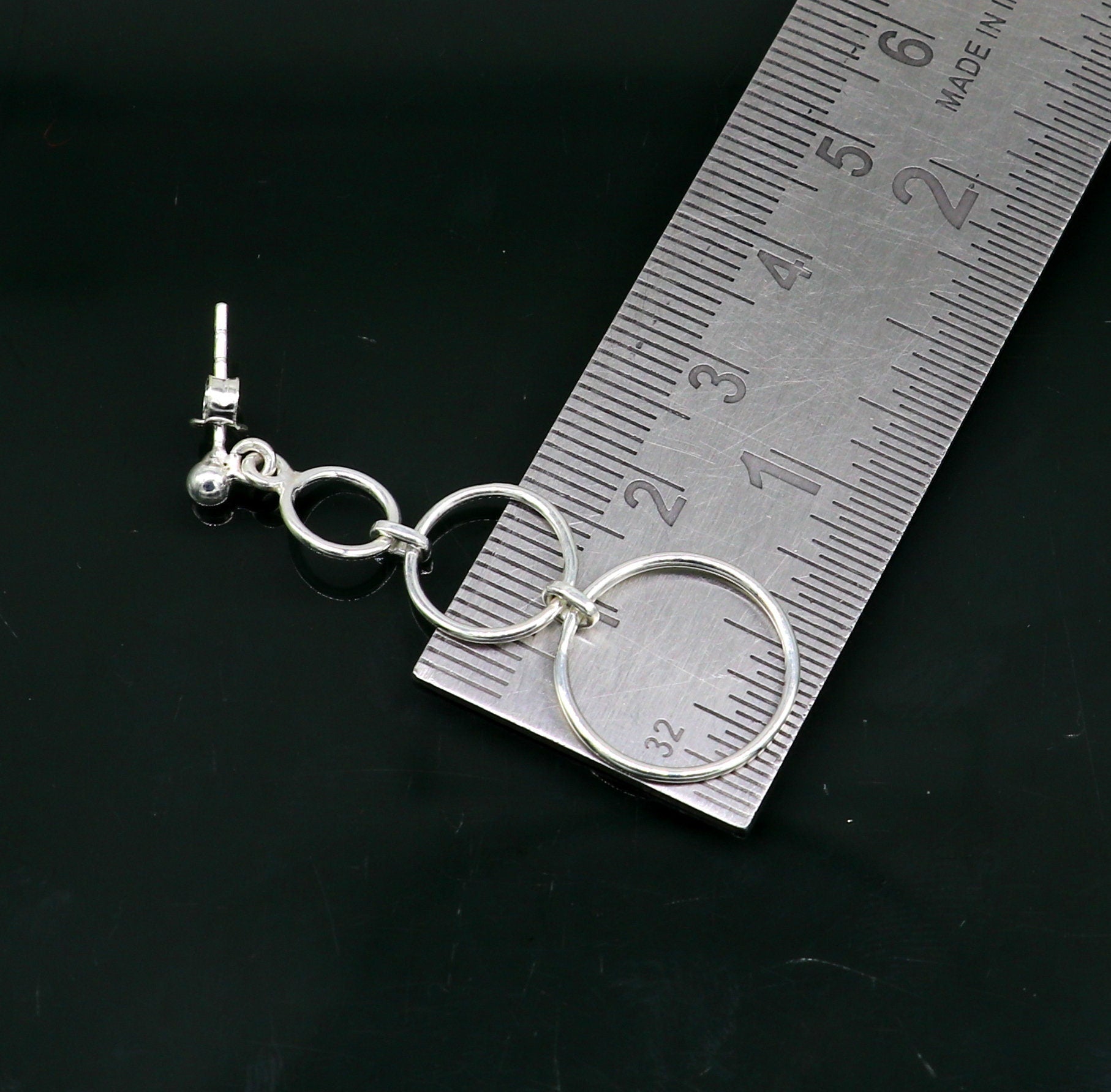 Sterling silver dainty stud earring with three circle design, geometric drop dangle style, by TRIBAL ORNAMENTS.