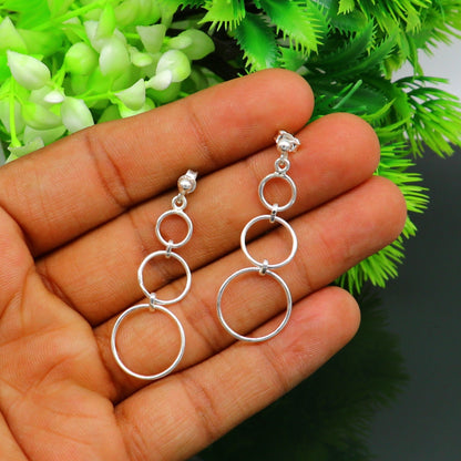 Sterling silver 925 dainty stud and drop dangle earrings with three geometric circles, designed by TRIBAL ORNAMENTS.