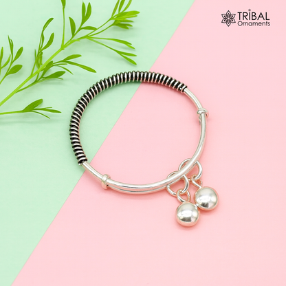 Sterling silver adjustable baby bangle bracelet with stylish tribal design and charm, unisex kids jewelry by Tribal Ornaments.