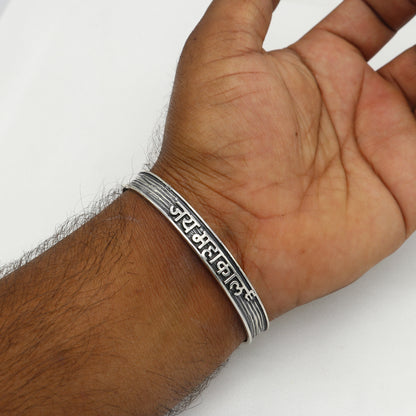 Sterling silver Lord Shiva Jai Mahakaal mantra adjustable bangle cuff for men and women, featuring intricate tribal design.