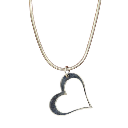 Sterling silver heart pendant by TRIBAL ORNAMENTS, stylish unisex jewelry with unique design, perfect personalized gift accessory.