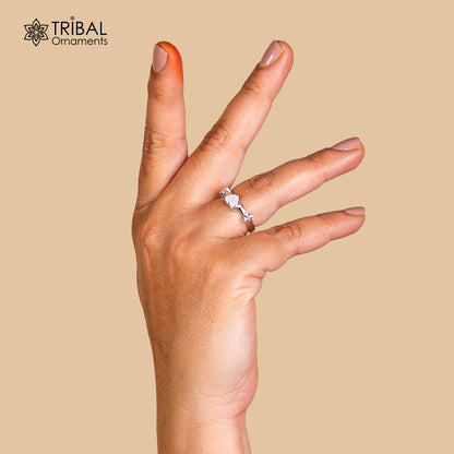 Silver ring with heart-shaped white stone design by TRIBAL ORNAMENTS, showcasing intricate tribal-inspired jewelry craftsmanship.