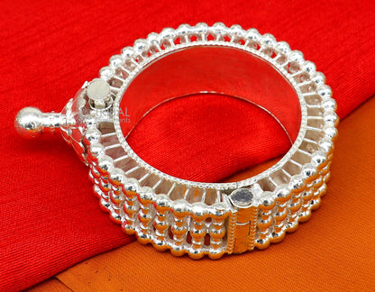 Tribal Ornament Indian traditional 925 sterling silver cuff kada bracelet with intricate vintage design on a bride's hand.