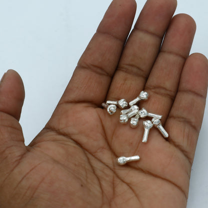 Set of 10 handmade 925 Sterling silver cloves for puja, crafted by Tribal Ornaments, ideal for religious offerings and gift-giving.