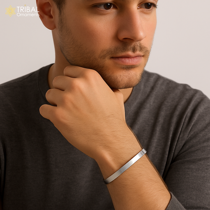 Obliq style shiny 925 silver bangle cuff, men's jewelry by TRIBAL ORNAMENTS, featuring a sleek, plain silver design.
