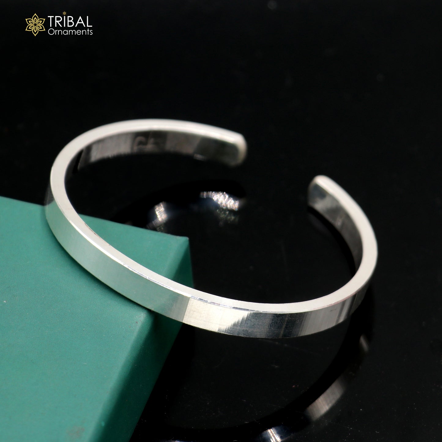Obliq style plain shiny 925 sterling silver men's bangle cuff from TRIBAL ORNAMENTS, featuring a sleek, polished silver design.