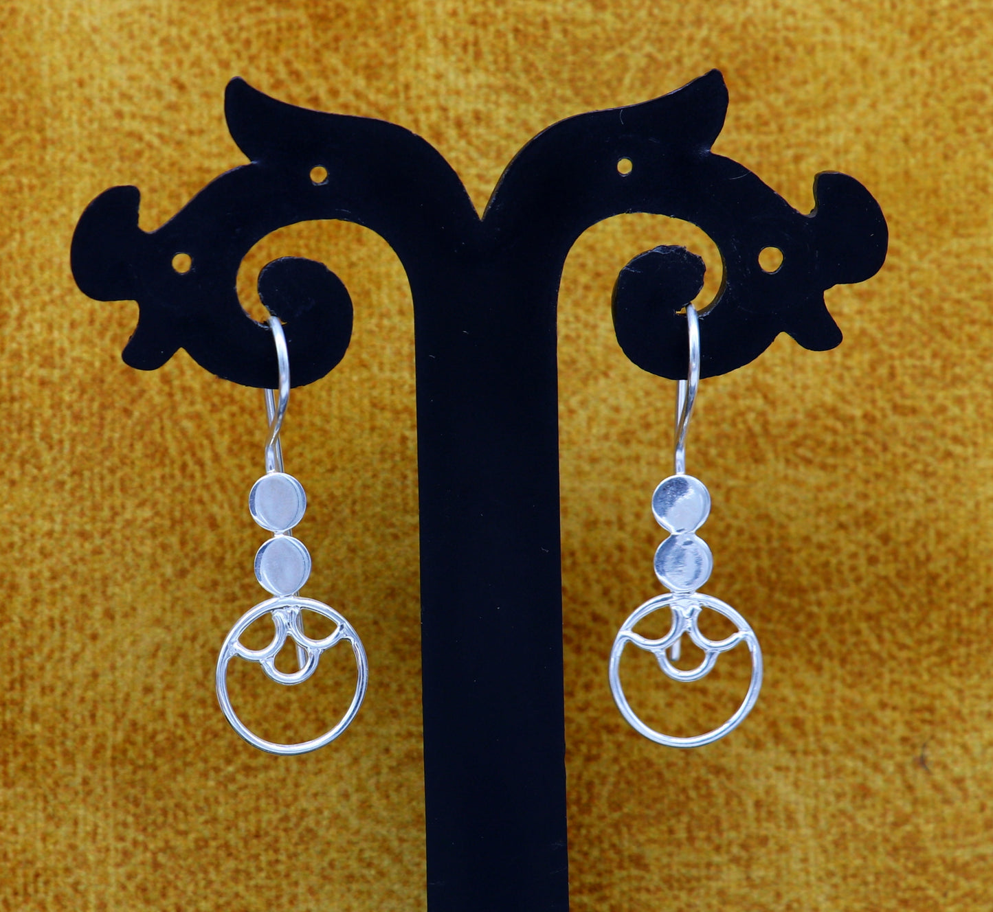 Handmade sterling silver hoop earring by TRIBAL ORNAMENTS featuring a circle shape, stamped 925, fashionable jewelry for women.