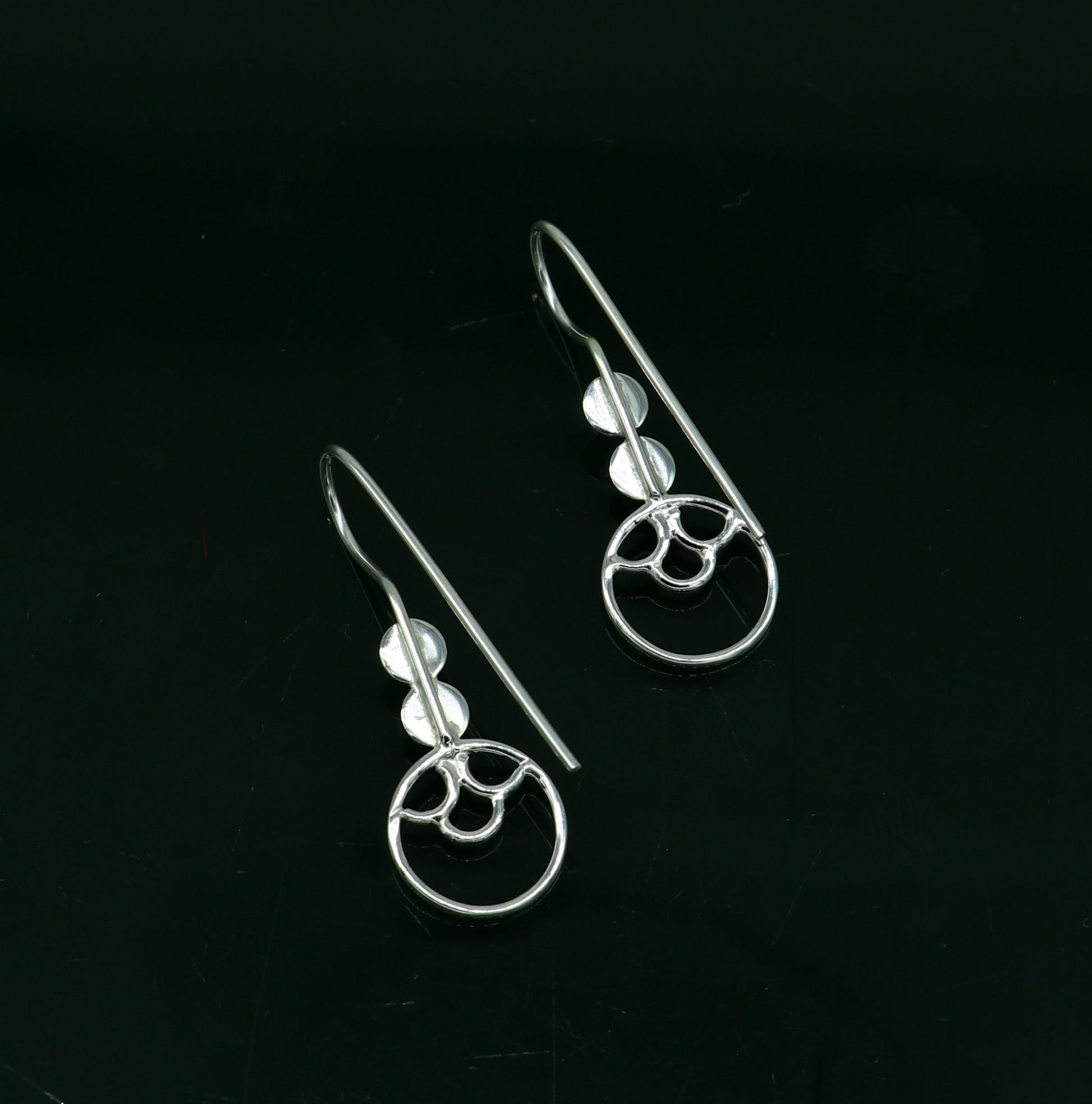 Sterling silver handmade circle hoop earring by TRIBAL ORNAMENTS, stamped 925, stylish design, perfect for gifting or fashionable wear.