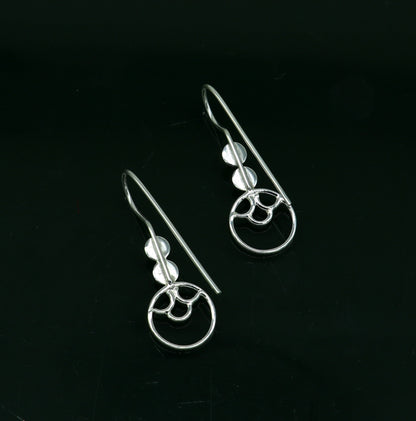 Sterling silver handmade circle hoop earring by TRIBAL ORNAMENTS, stamped 925, stylish design, perfect for gifting or fashionable wear.