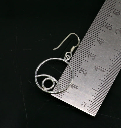 Sterling silver handmade circle hoop earring with drop dangle charm, designed for girls and brides, by TRIBAL ORNAMENTS.