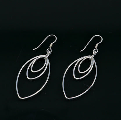 Sterling silver handmade eclipse-style hoop earring with geometric drop dangle, elegant and trendy jewelry from TRIBAL ORNAMENTS.