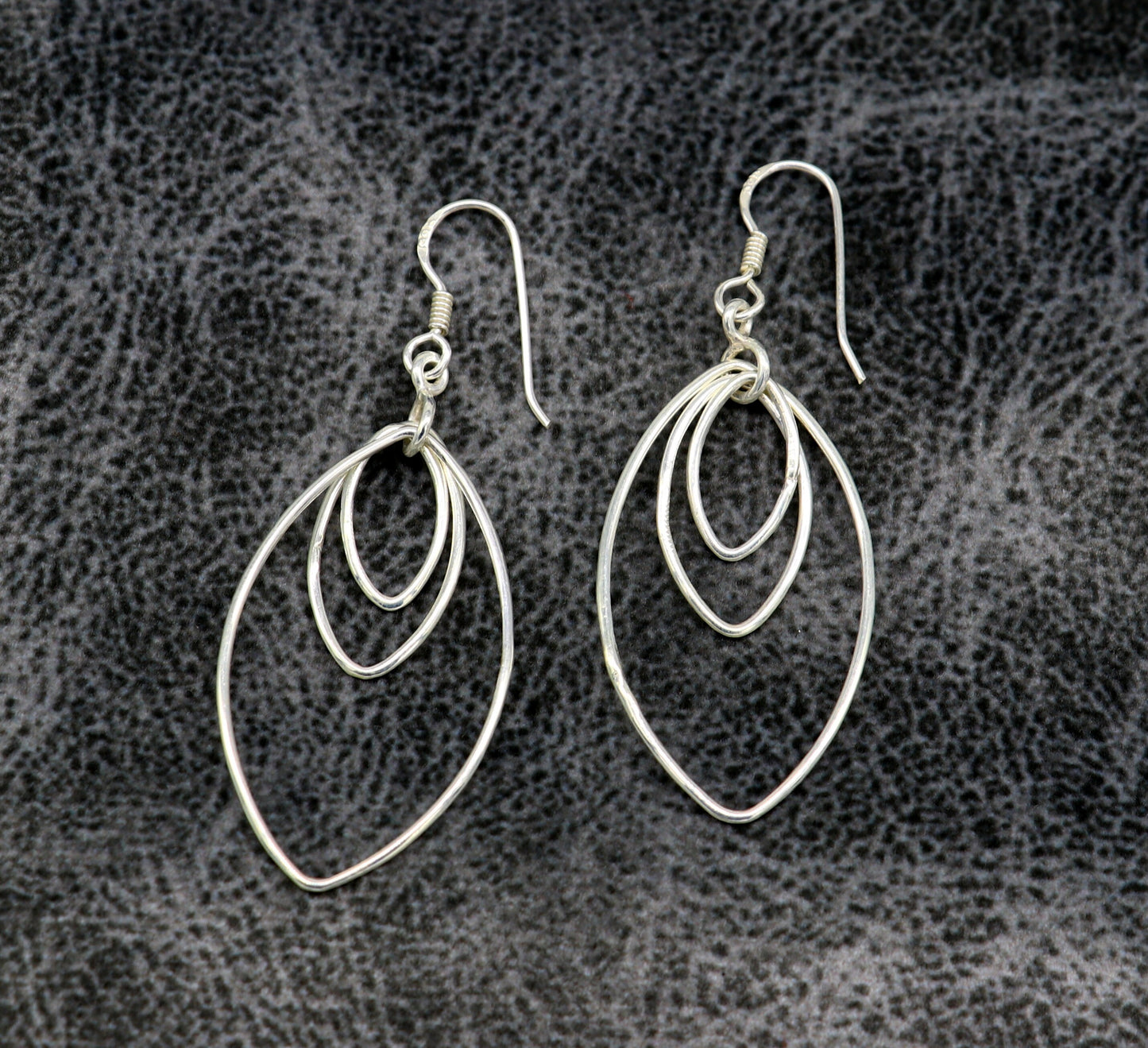 Sterling silver handmade eclipse-style hoop earring with geometric design, elegant and trendy drop dangle jewelry for women.