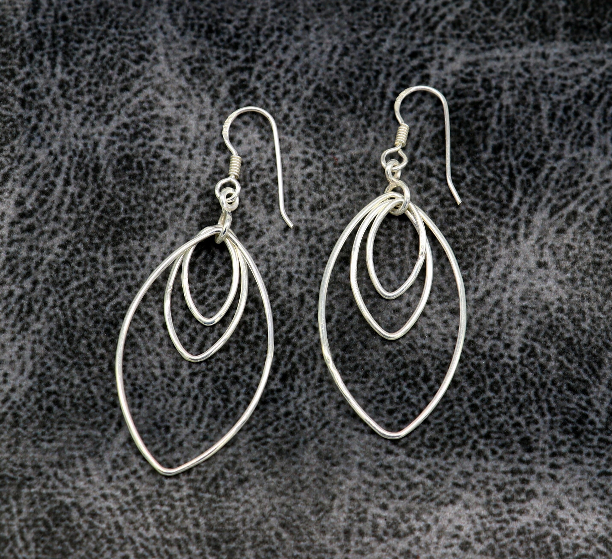 Sterling silver handmade eclipse-style hoop earring with geometric design, elegant and trendy drop dangle jewelry for women.