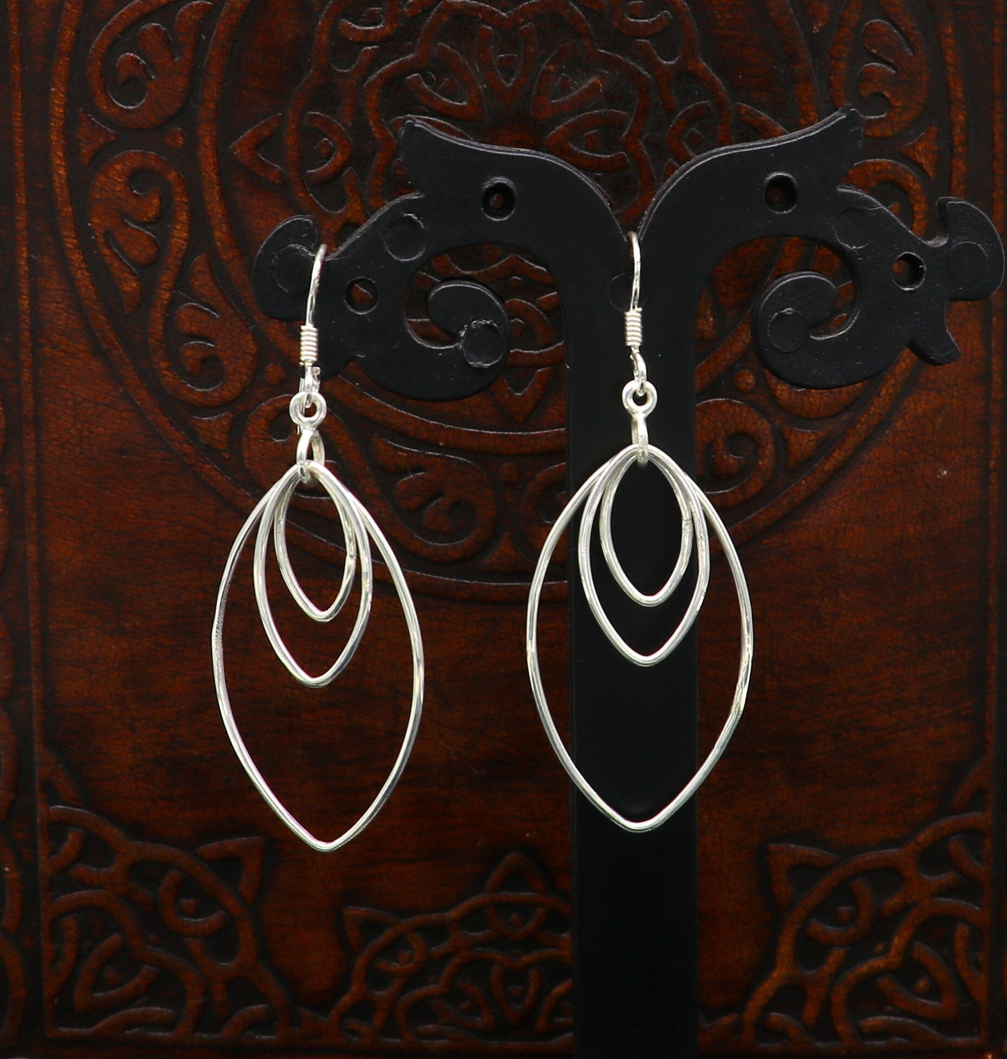 Sterling silver eclipse style hoop earring with geometric drop dangle, handmade and elegant from TRIBAL ORNAMENTS.