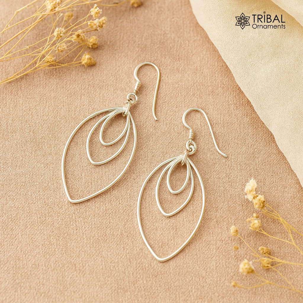 Sterling silver eclipse-style handmade hoop earrings with geometric drop design, elegant and trendy jewelry by TRIBAL ORNAMENTS.