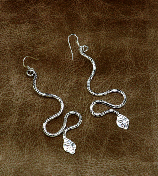 Sterling silver handmade snake design hoop earring by TRIBAL ORNAMENTS, vintage and stylish bridal jewelry with intricate details.