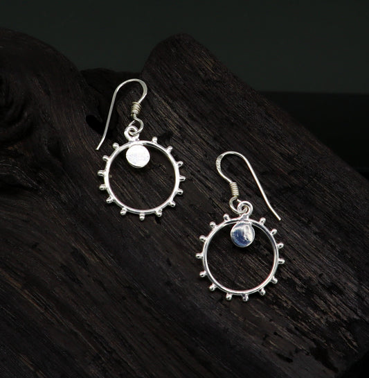 Sterling silver handmade hoop earring with dangle charm, trendy designer style for girls and brides, by TRIBAL ORNAMENTS.