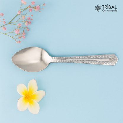 Handmade 6-inch sterling silver spoon from TRIBAL ORNAMENTS, showcasing its polished surface and classic kitchen utensil design.