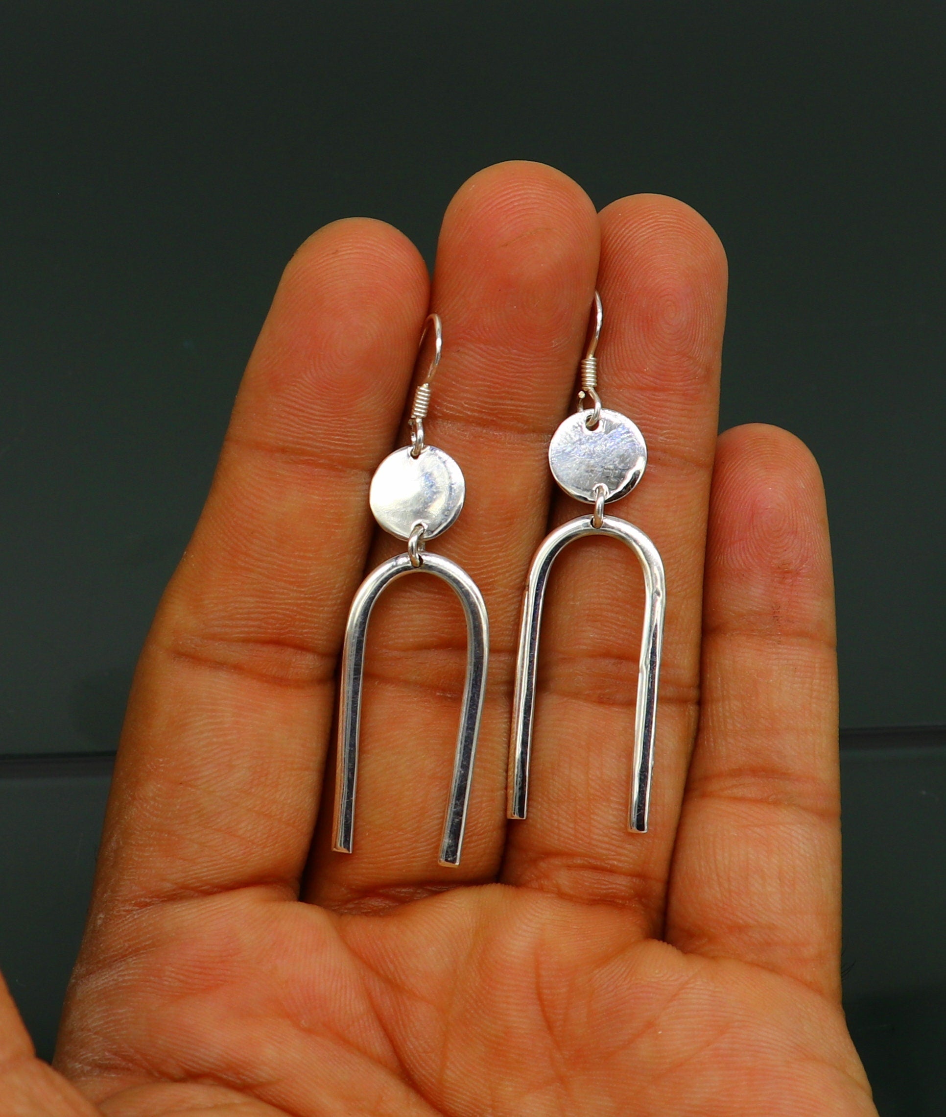 Sterling silver drop hoop earrings from TRIBAL ORNAMENTS, shiny plain dangle design, ideal for brides or gifting from India.