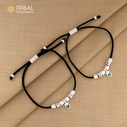 Silver thread stylish anklet with intricate design from TRIBAL ORNAMENTS, featuring silver dhaga payal on a white background.