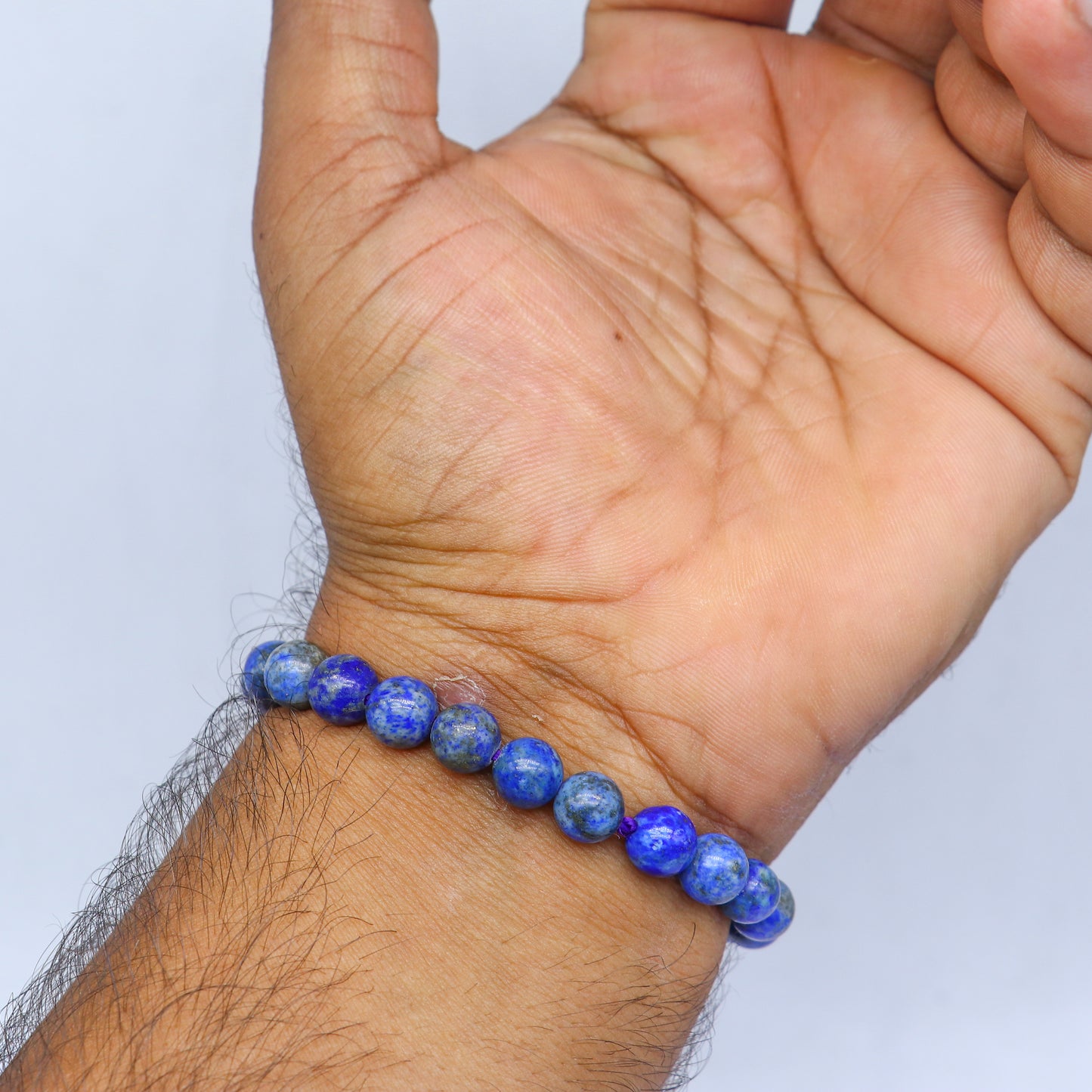 Sodalite crystal bracelet by TRIBAL ORNAMENTS featuring blue stones for calming and balancing energy.