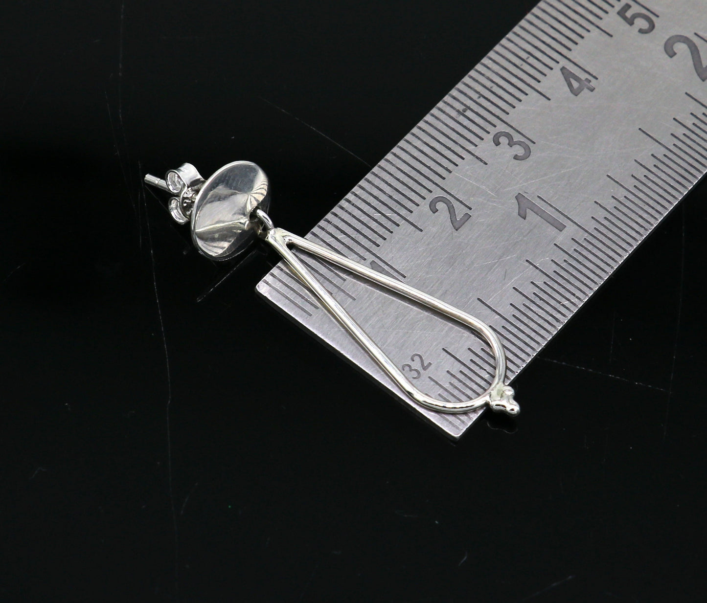 Sterling silver dainty stud and drop geometric earrings by TRIBAL ORNAMENTS, customized and unique design for elegant style.