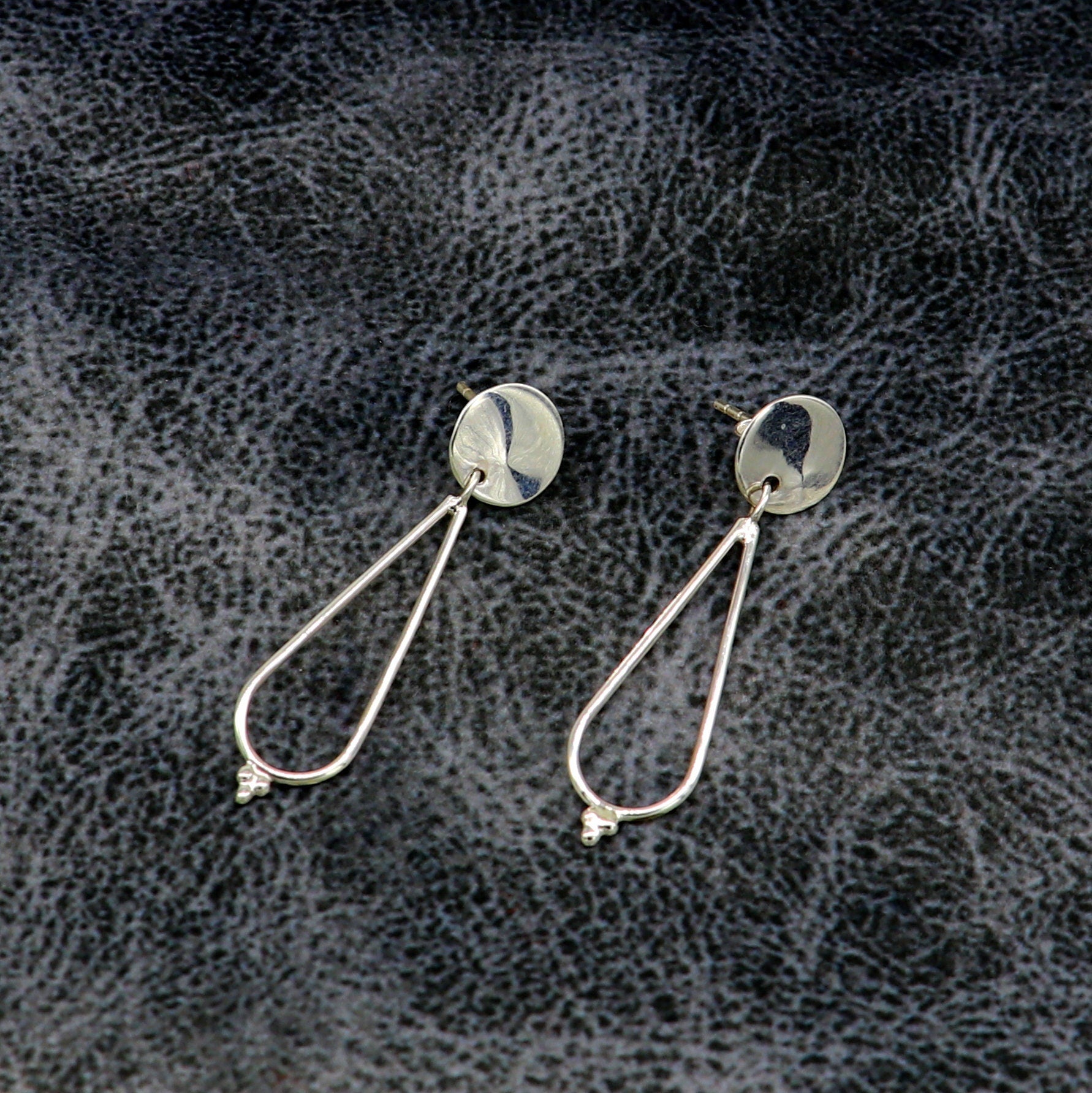 Sterling silver geometric stud and dangle earrings by TRIBAL ORNAMENTS, featuring unique custom design and dainty style for her ears.