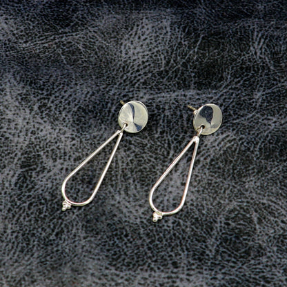 Sterling silver geometric stud and dangle earrings by TRIBAL ORNAMENTS, featuring unique custom design and dainty style for her ears.