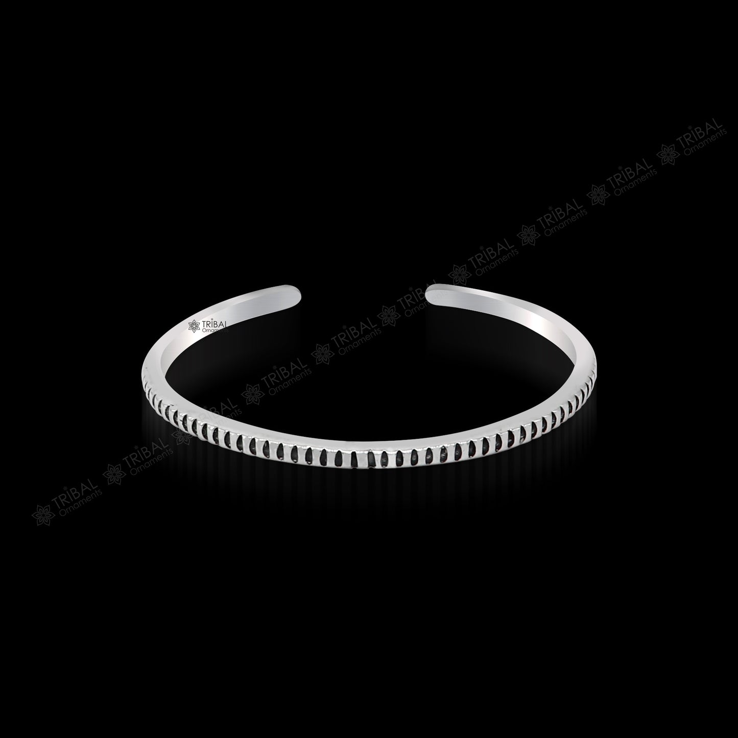 Handmade 925 sterling silver adjustable cuff bangle bracelet from TRIBAL ORNAMENTS, unisex jewelry with intricate tribal design.
