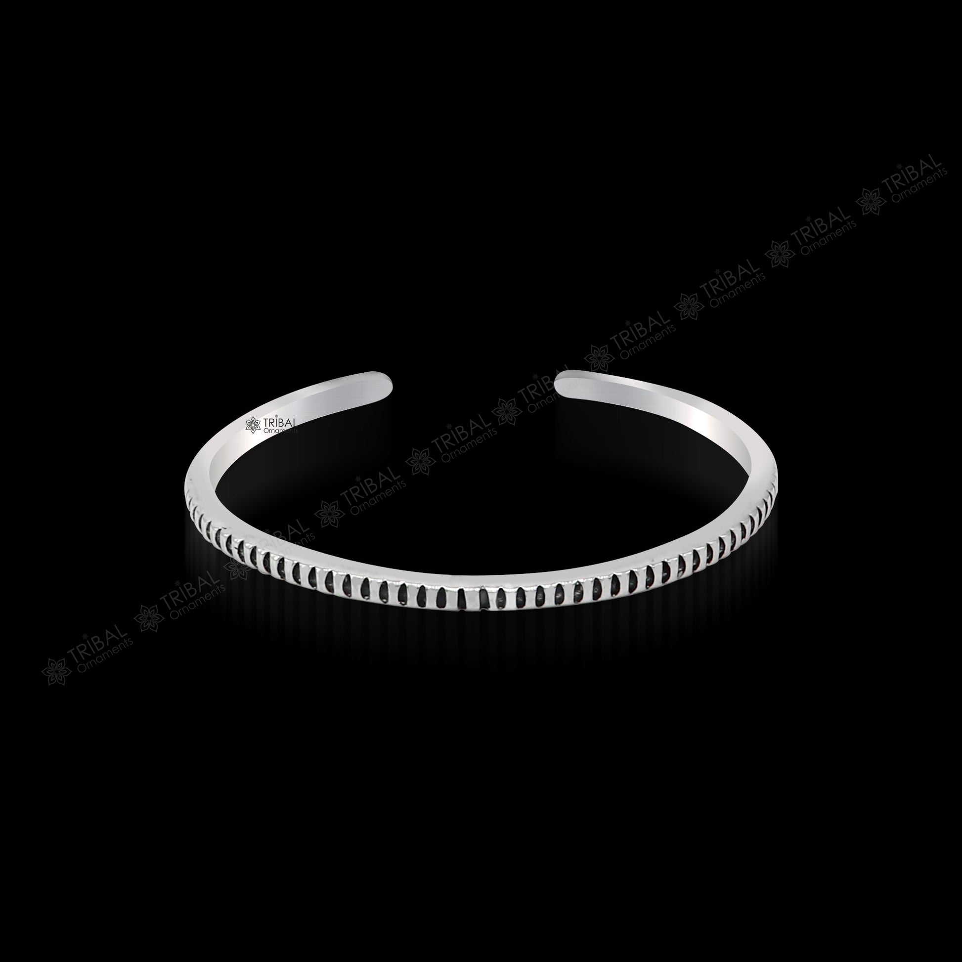 Handmade 925 sterling silver adjustable cuff bangle bracelet from TRIBAL ORNAMENTS, unisex jewelry with intricate tribal design.