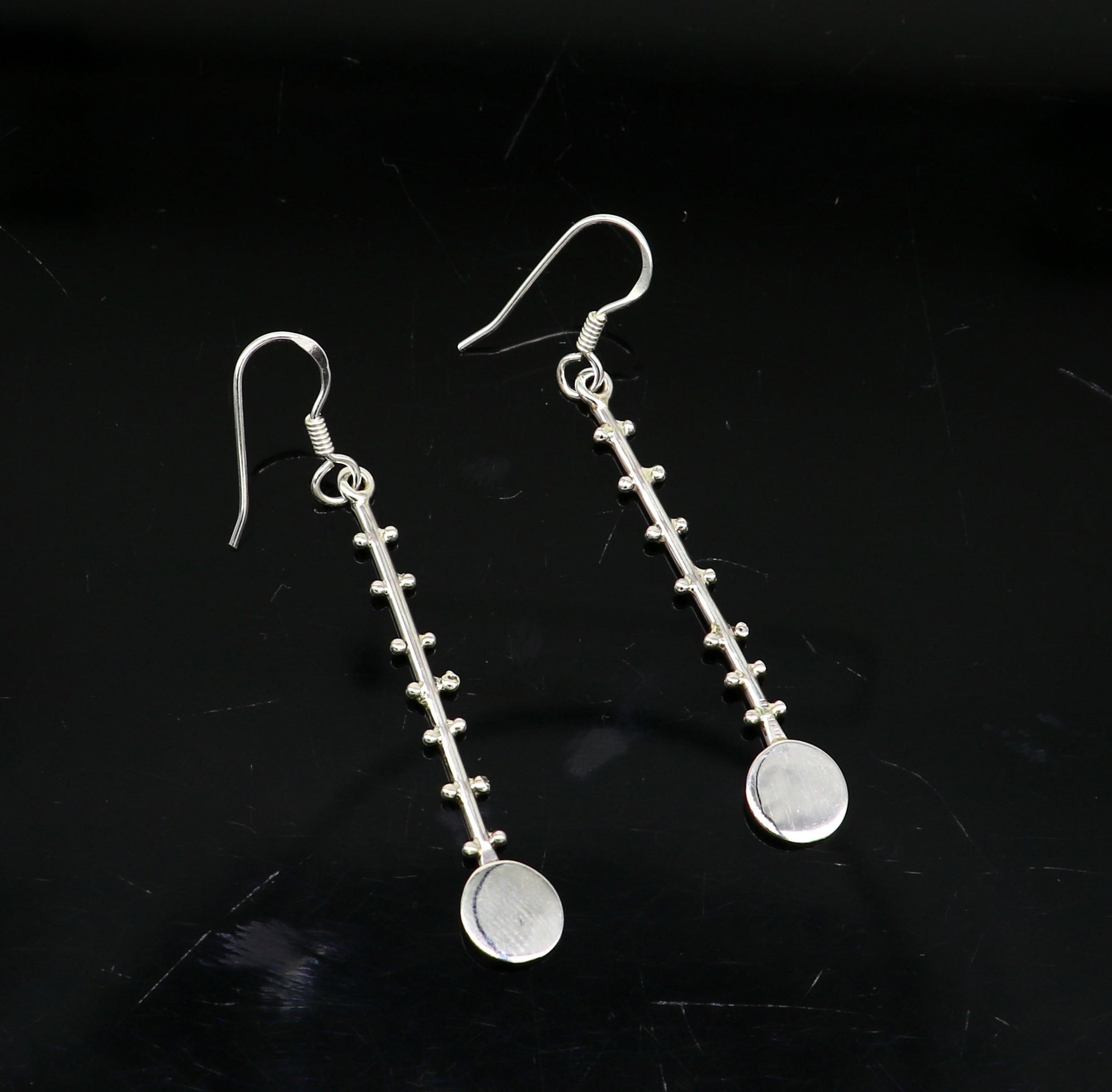 Solid 925 sterling silver handmade drop dangle hoop earring by TRIBAL ORNAMENTS, featuring stamped design for fashionable jewelry.