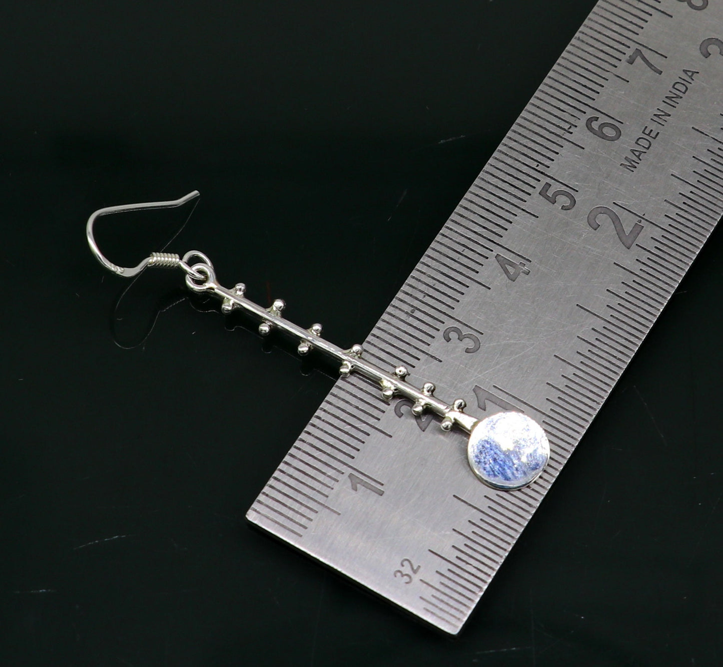 Sterling silver handmade drop dangle hoop earring by Tribal Ornaments, stamped 925, featuring a fashionable and elegant design.