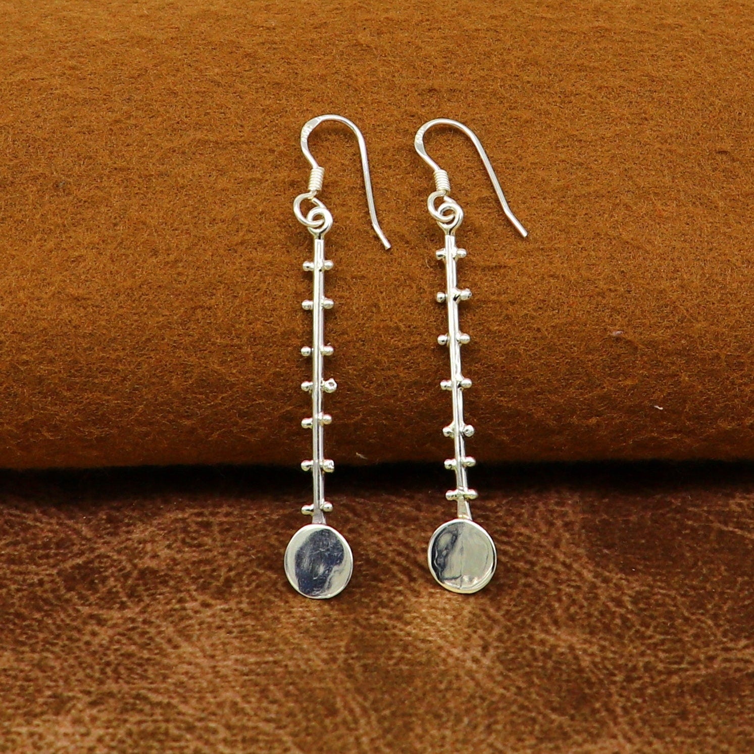 Solid 925 sterling silver handmade drop dangle hoop earring by TRIBAL ORNAMENTS, featuring stamped design and fashionable jewelry style.