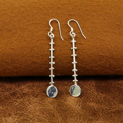Solid 925 sterling silver handmade drop dangle hoop earring by TRIBAL ORNAMENTS, featuring stamped design and fashionable jewelry style.