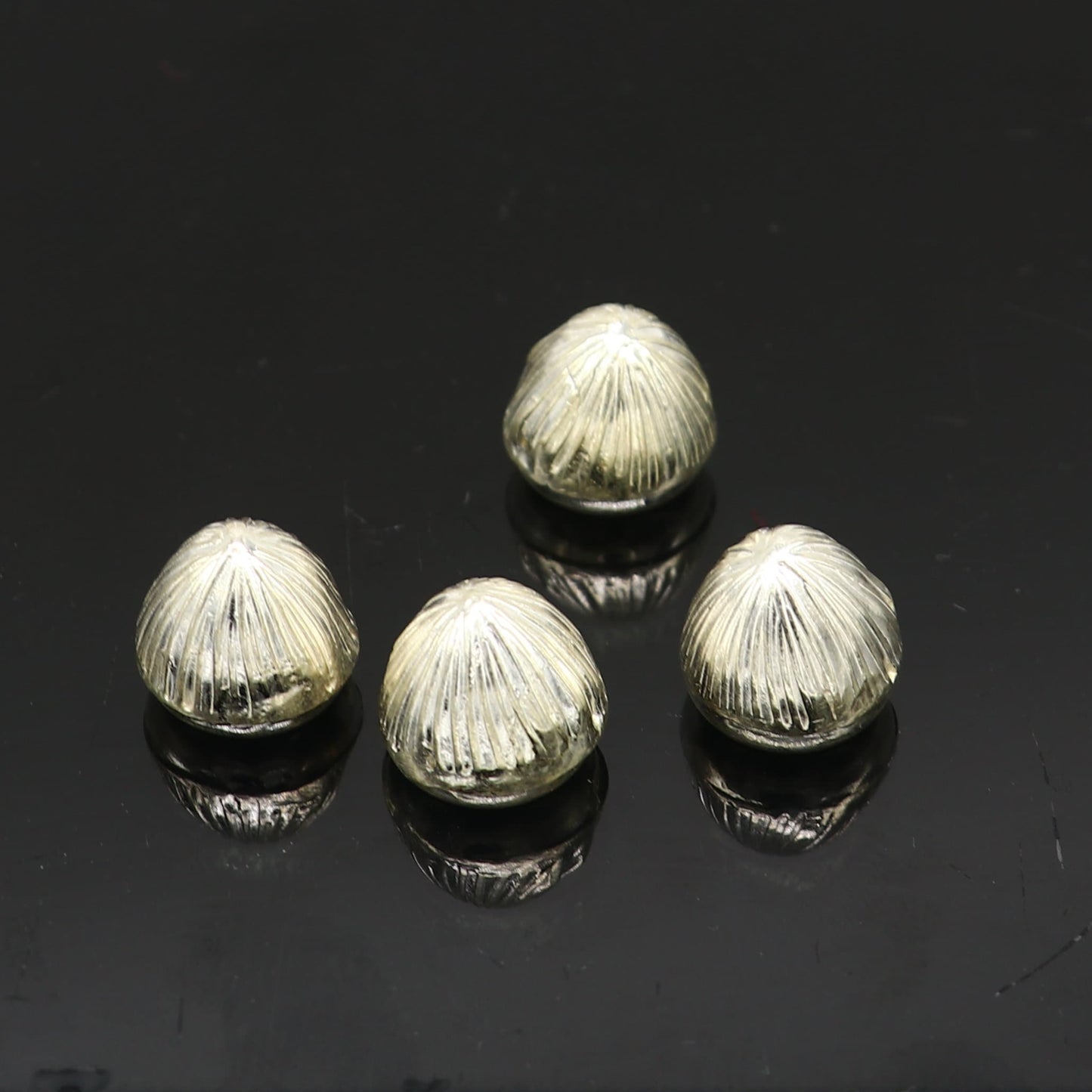 Sterling silver handmade Betal palm tree seed Supari, puja article from TRIBAL ORNAMENTS, used in worship and spiritual rituals.